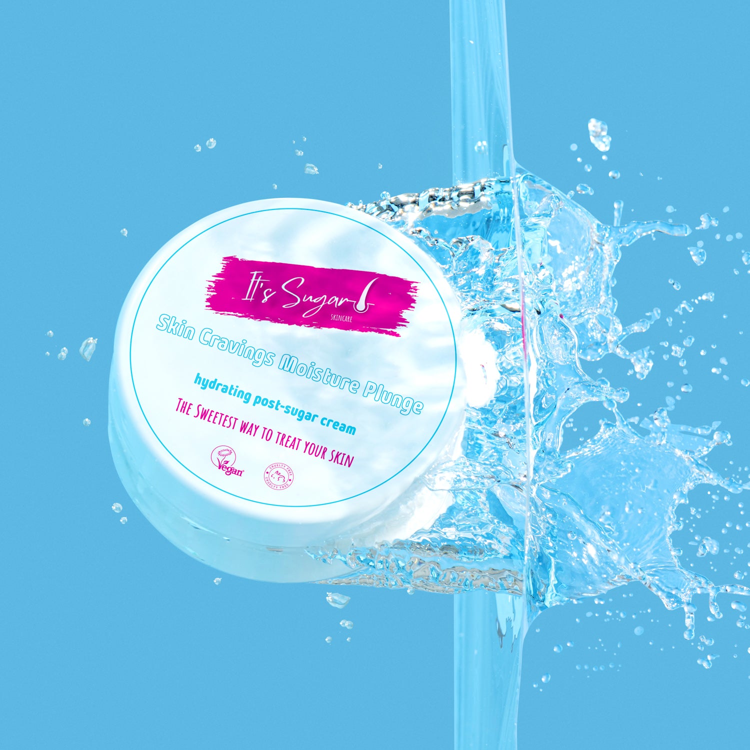 Jar of 'It's Sugar!' Skin Cravings moisture Plunge cream plunging into water with water splashes on a blue background