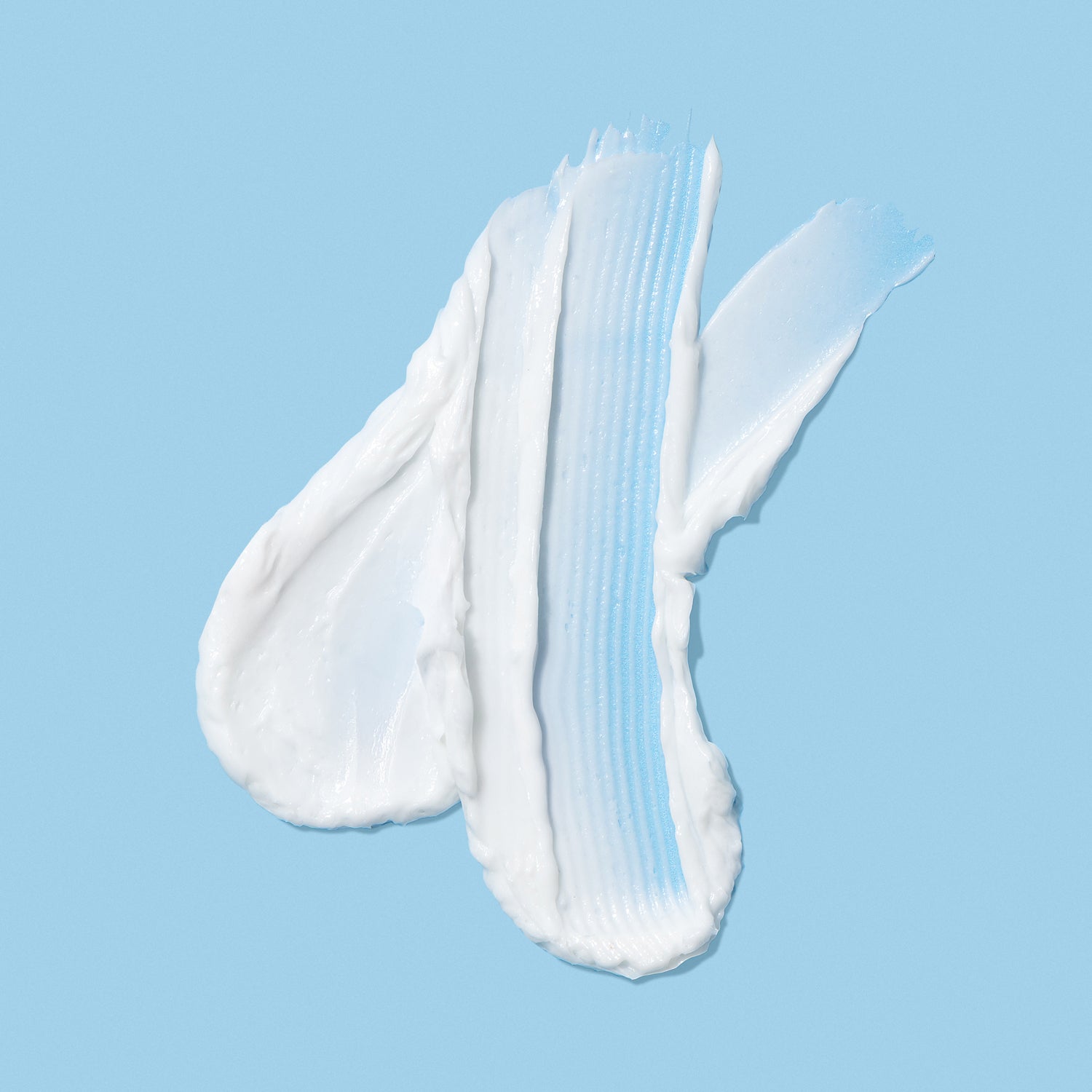 Skin Cavings Moisture Plunge White cream swatch on a light blue background